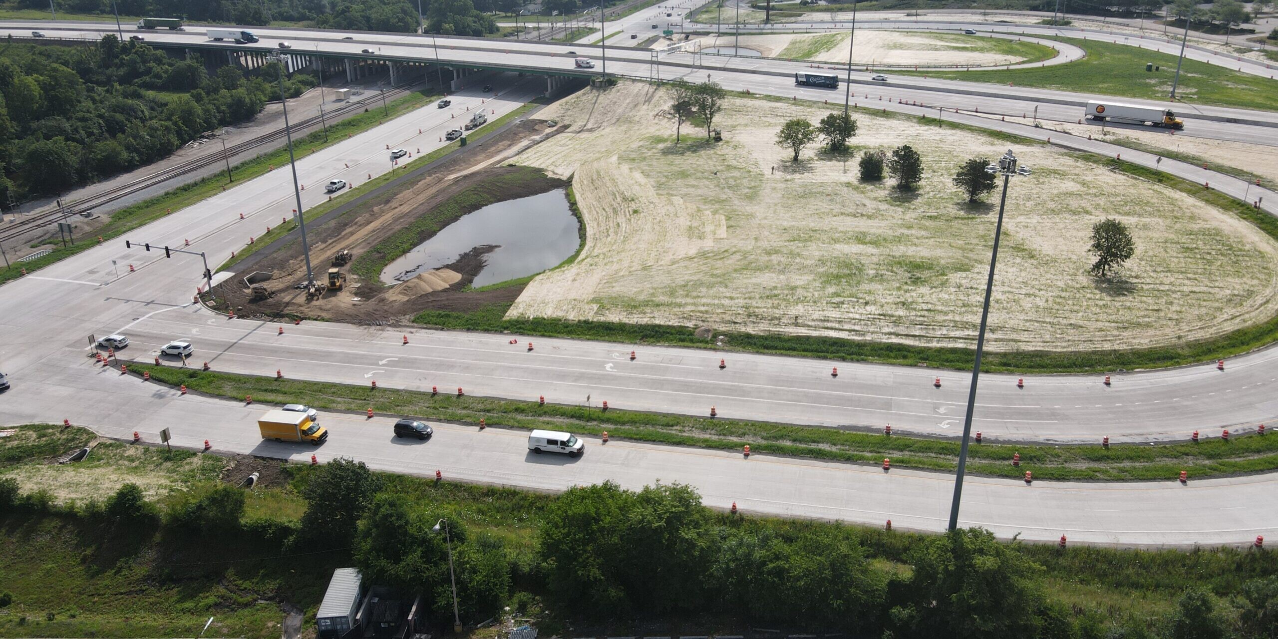 A view of an intersection with a highway in the background.