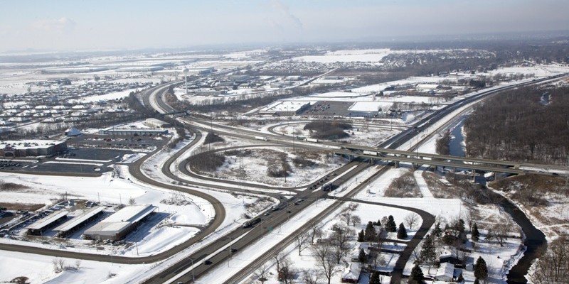 A view of an intersection in the snow.