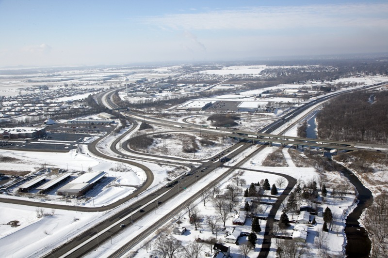 A view of an intersection in the snow.