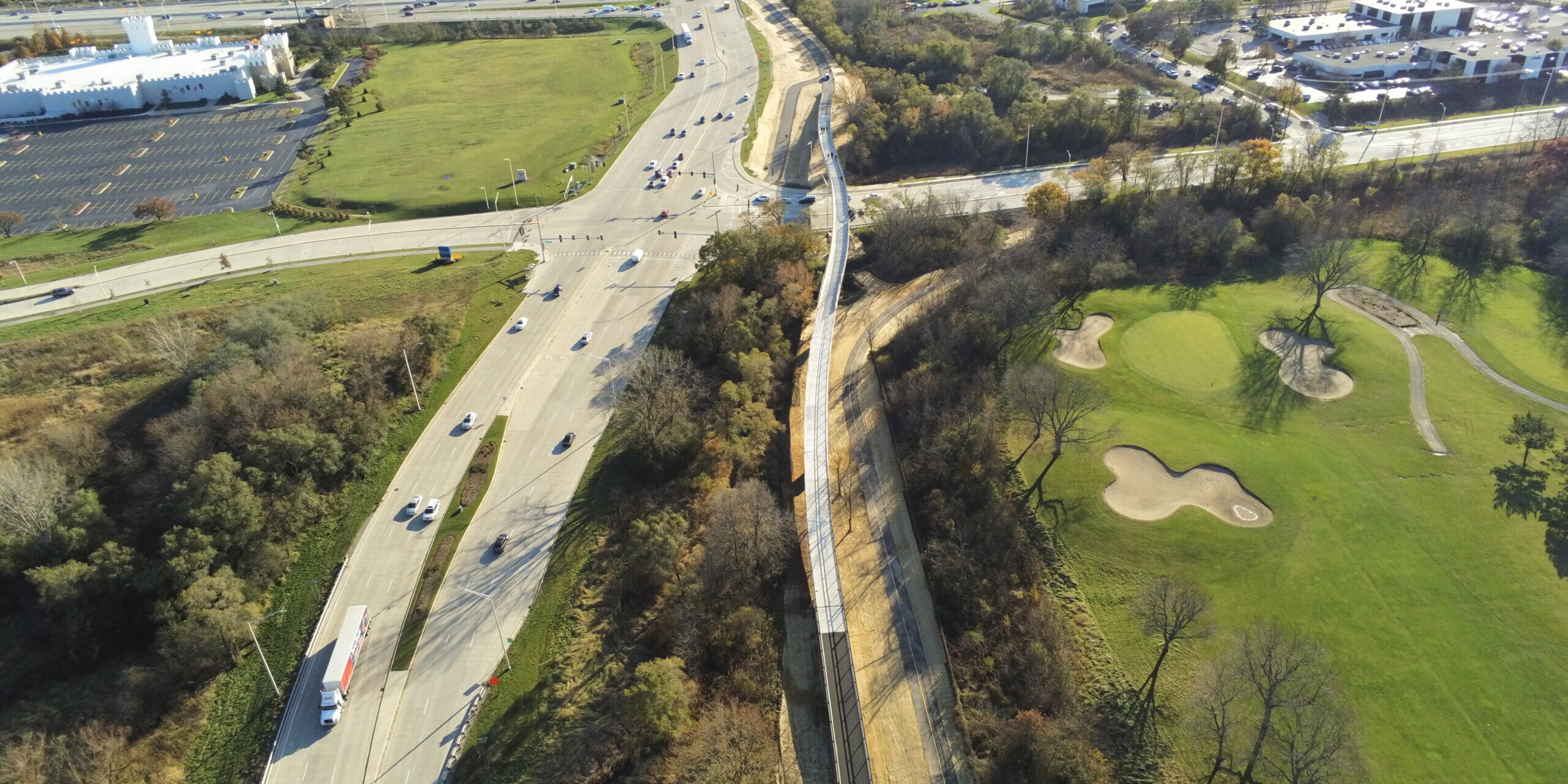 An aerial view of a highway with cars driving on it.