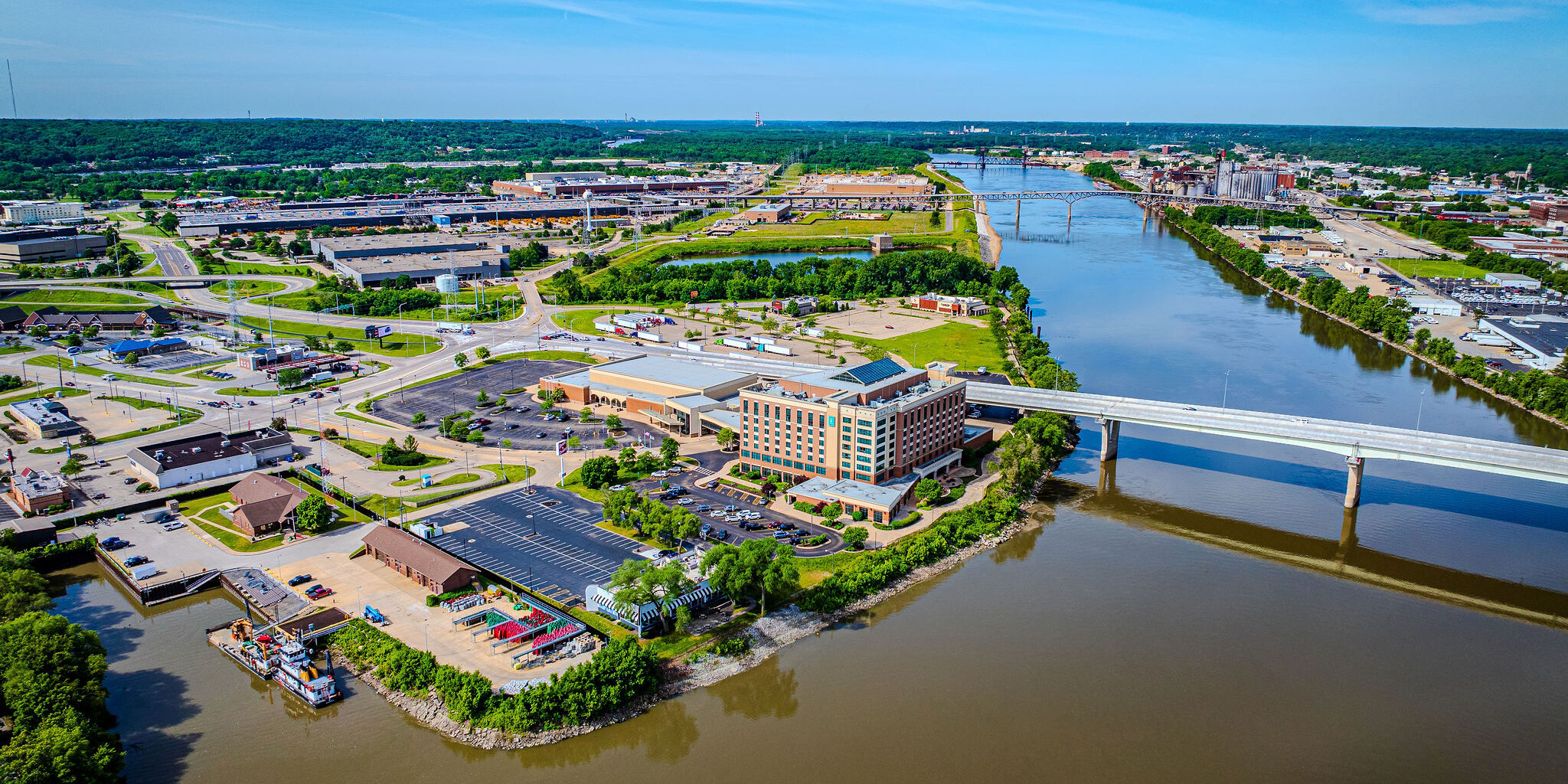 A view of the city from above, with water in front.