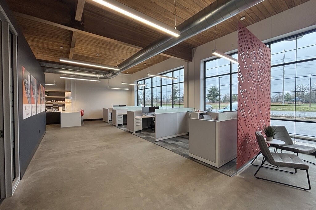 Modern open office with cubicles and large windows
